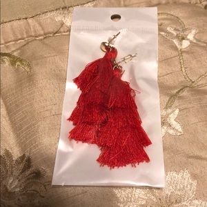 Reddish orange tassel earrings